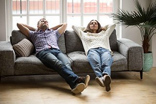 Two people enjoying there clean home